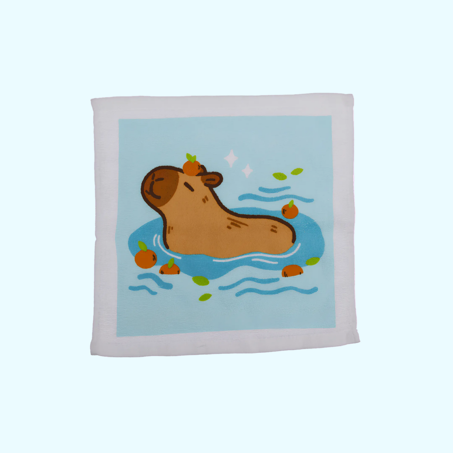 Capybara - Magisches Baumwollhandtuch 30x30cm - Capybara mit blauem Hintergrund - SNACKS24.AT